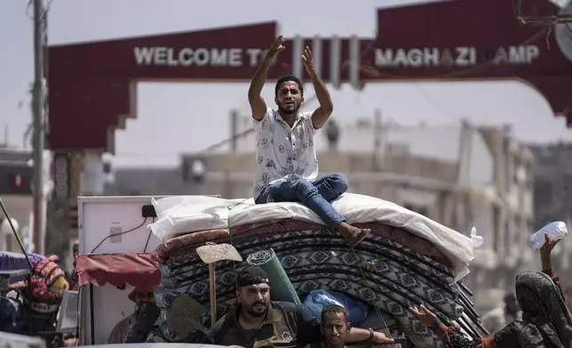 Palestinians evacuate Maghazi refugee camp in the central Gaza Strip, as part of a mass evacuation ordered by the Israeli military ahead of an operation, Saturday, Aug. 17, 2024. (AP Photo/Abdel Kareem Hana)