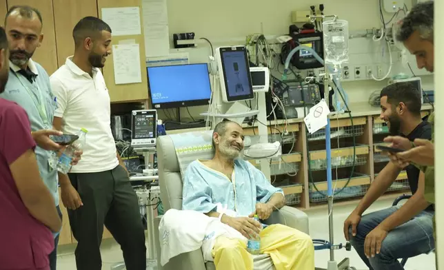 In this photo released by the Israel Prime Minister Office on Tuesday, Aug. 27, 2024, Kaid Farhan Al-Qadi, 52, who was held hostage by Hamas militants in Gaza sits in a room at the Soroka Medical Center in Beersheba, Israel. (Israel Prime Minister Office via AP)