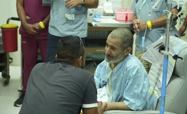 In this photo released by the Israel Prime Minister Office on Tuesday, Aug. 27, 2024, Qaid Farhan Alkadi, 52, who was held hostage by Hamas militants in Gaza sits in a room at the Soroka Medical Center in Beersheba, Israel. (Israel Prime Minister Office via AP)