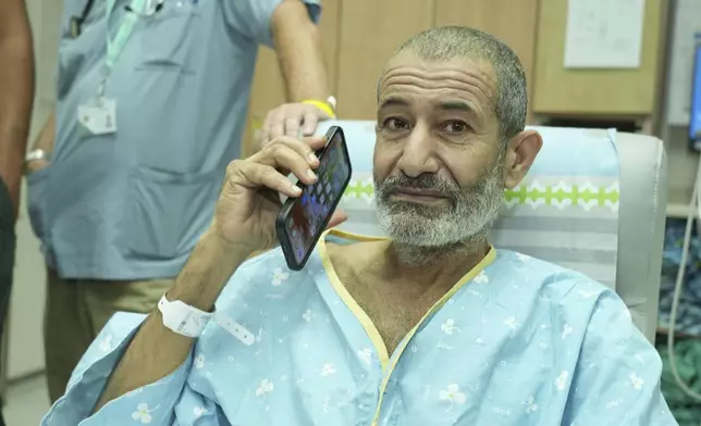 In this photo released by the Israel Prime Minister Office on Tuesday, Aug. 27, 2024, Kaid Farhan Al-Qadi, 52, who was held hostage by Hamas militants in Gaza sits on a sofa in a room at the Soroka Medical Center in Beersheba, Israel. (Israel Prime Minister Office via AP)