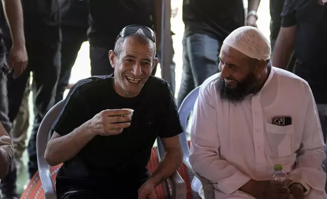 Qaid Farhan Alkadi, 52, who was held hostage by Hamas militants in Gaza Strip, drinks a coffee after arriving in the Khirbet Karkur village, near Rahat, southern Israel, Wednesday, Aug. 28, 2024. (AP Photo/Mahmoud Illean)