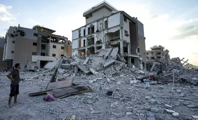 Palestinians inspect their houses after they were destroyed by the Israeli bombardment on east of Deir al-Balah, Thursday, Aug. 29, 2024. (AP Photo/Abdel Kareem Hana)