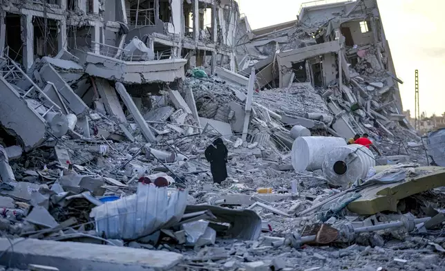 Palestinians inspect their houses after it were destroyed by the Israeli bombardment on east of Deir al-Balah, Thursday, Aug. 29, 2024. (AP Photo/Abdel Kareem Hana)