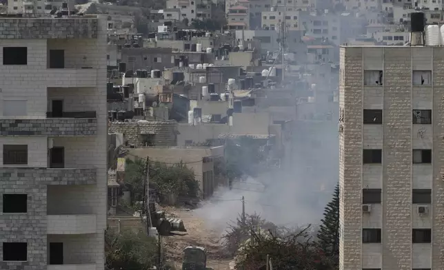 Smoke rises after an explosion during an Israeli military operation in the West Bank Jenin refugee camp, Saturday, Aug. 31, 2024. (AP Photo/Majdi Mohammed)