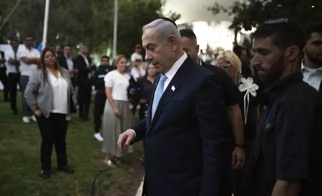 Israeli Prime Minister Benjamin Netanyahu, center, attends the state memorial for Ze'ev Jabotinsky, at Mount Herzl Military Cemetery in Jerusalem, Sunday, Aug. 4, 2024. (Naama Grynbaum/Pool Photo via AP)