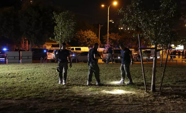 Israeli police work at the scene of a bomb explosion in Tel Aviv, Israel, Sunday, Aug. 18, 2024. Israeli police say one person was killed and another moderately injured. (AP Photo/Moti Milrod)