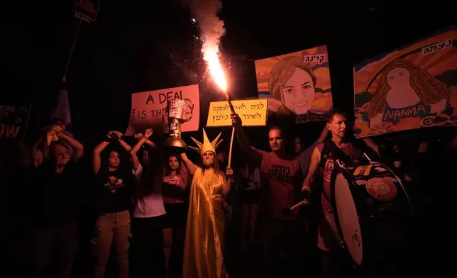 Relatives of hostages held by Hamas militants in the Gaza Strip and their supporters call for their immediate release and to protest against Israeli Prime Minister Benjamin Netanyahu's government in Tel Aviv, Israel, Saturday, Aug. 17, 2024. (AP Photo/Tsafrir Abayov)