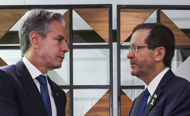 U.S. Secretary of State Antony Blinken, left, meets with Israel's President Isaac Herzog, in Tel Aviv, Israel, Monday, Aug. 19, 2024. (Kevin Mohatt/Pool Photo via AP)