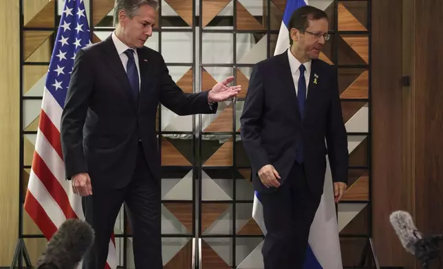 U.S. Secretary of State Antony Blinken, left, meets with Israel's President Isaac Herzog, in Tel Aviv, Israel, Monday, Aug. 19, 2024. (Kevin Mohatt/Pool Photo via AP)