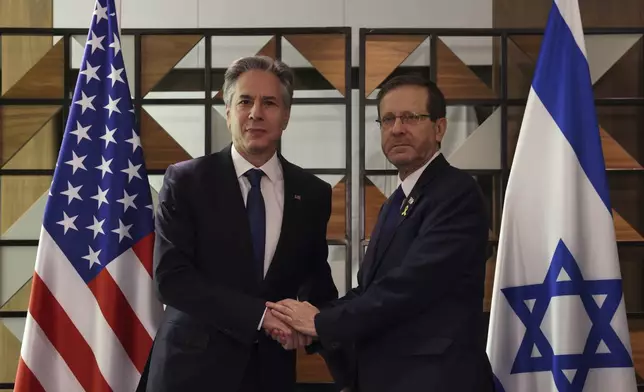 U.S. Secretary of State Antony Blinken, left, meets with Israel's President Isaac Herzog, in Tel Aviv, Israel, Monday, Aug. 19, 2024. (Kevin Mohatt/Pool Photo via AP)