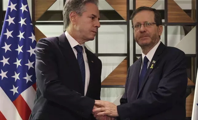 U.S. Secretary of State Antony Blinken, left, meets with Israel's President Isaac Herzog, in Tel Aviv, Israel, Monday, Aug. 19, 2024. (Kevin Mohatt/Pool Photo via AP)