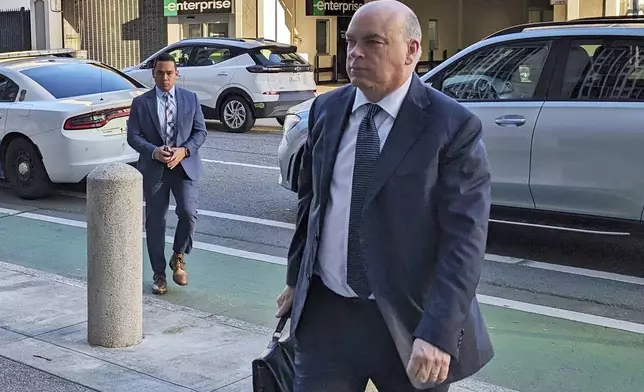 FILE - British tech magnate Mike Lynch walks into federal court in San Francisco, March 26, 2024, (AP Photo/Michael Liedtke, File)