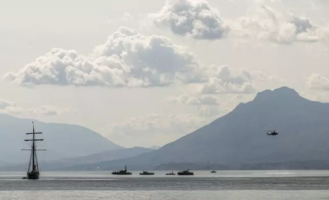 Rescuers work in the area where the UK flag vessel Bayesan that was hit by a violent sudden storm, sunk early Monday, Aug. 19, 2024, while at anchor off the Sicilian village of Porticello near Palermo, in southern Italy. (AP Photo/Lucio Ganci)