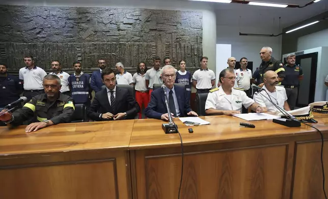 Italian Prosecutor Ambrogio Cartosio, center, attends a press conference on the shipwreck of the Bayesian in Termini Imerese, Sicily, Aug. 24, 2024. (Raffaele Macauda/LaPresse via AP)