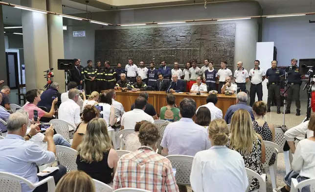 Italian Prosecutor Ambrogio Cartosio, background center, attends a press conference on the shipwreck of the Bayesian in Termini Imerese, Sicily, Aug. 24, 2024. (Raffaele Macauda/LaPresse via AP)