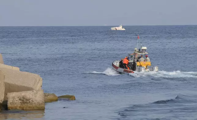 Italian Firefighters scubadivers sails towards the area where the UK flag vessel Bayesan that was hit by a violent sudden storm, sunk early Monday, Aug. 19, 2024, while at anchor off the Sicilian village of Porticello near Palermo, in southern Italy. (AP Photo/Lucio Ganci)