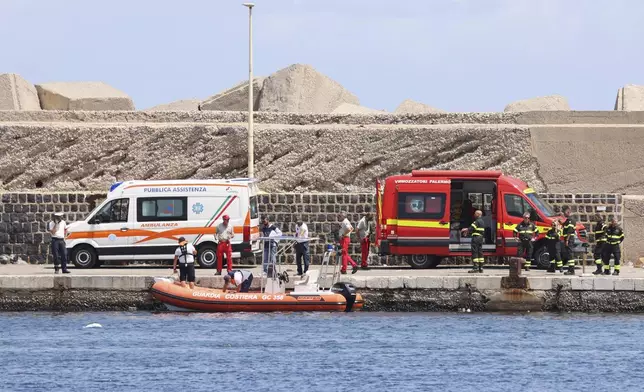 Emergency services at the scene of the search for a missing boat, in Porticello Santa Flavia, Italy, Monday, Aug. 19, 2024. British tech giant Mike Lynch, his lawyer and four other people are among those missing after their luxury superyacht sank during a freak storm off Sicily, Italy’s civil protection and authorities said. Lynch’s wife and 14 other people survived. (Alberto Lo Bianco /LaPresse via AP)