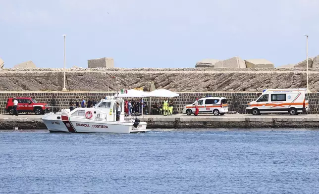 Emergency services at the scene of the search for a missing boat, in Porticello Santa Flavia, Italy, Monday, Aug. 19, 2024. British tech giant Mike Lynch, his lawyer and four other people are among those missing after their luxury superyacht sank during a freak storm off Sicily, Italy’s civil protection and authorities said. Lynch’s wife and 14 other people survived. (Alberto Lo Bianco /LaPresse via AP)