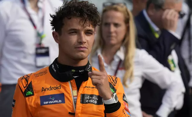 McLaren driver Lando Norris of Britain celebrates his pole position after qualifying session ahead of the Formula One Italian Grand Prix race at the Monza racetrack, in Monza, Italy, Saturday, Aug. 31, 2024. (AP Photo/Luca Bruno)