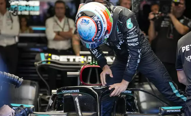 Mercedes driver Andrea Kimi Antonelli of Italy enters his car during the first free practice ahead of the Formula One Italian Grand Prix race at the Monza racetrack, in Monza, Italy, Friday, Aug. 30, 2024. (AP Photo/Luca Bruno)