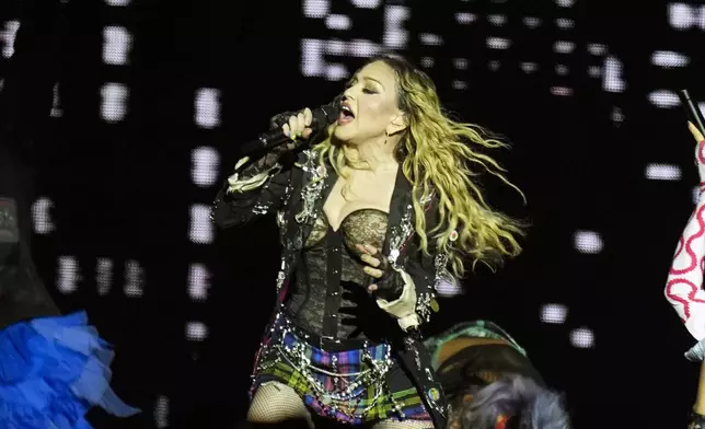 FILE - Madonna performs in the final show of her The Celebration Tour, on Copacabana Beach in Rio de Janeiro, Brazil, on May 4, 2024. Madonna will celebrate her 66th birthday with a private evening tour of the famed Italian archaeological site at Pompeii, officials said. (AP Photo/Silvia Izquierdo, File)