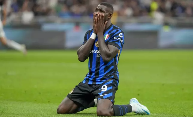 Inter Milan's Marcus Thuram reacts after missing a chance to score during the Serie A soccer match between Inter Milan and Atalanta at the at the San Siro stadium in Milan, Italy, Friday, Aug. 30, 2024. (AP Photo/Luca Bruno)