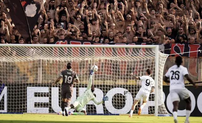 Parma's Dennis Man scores their side's first goal of the game during the Italian Serie A soccer match between Parma and Milan at Parma's Ennio Tardini Stadium in Parma, Italy, Saturday Aug. 24, 2024. (Massimo Paolone/LaPresse via AP)