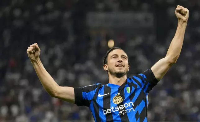 Inter Milan's Matteo Darmian celebrates after scoring his side's opening goal during a Serie A soccer match between Inter Milan and Lecce, at the San Siro stadium in Milan, Italy, Saturday, Aug. 24, 2024. (AP Photo/Luca Bruno)