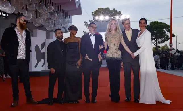 Cristobal Tapia de Veer, from left, producer David Hinojosa, Sophie Wilde, Antonio Banderas, Nicole Kidman, Harris Dickinson and director Halina Reijn pose for photographers upon arrival for the premiere of the film 'Babygirl' during the 81st edition of the Venice Film Festival in Venice, Italy, on Friday, Aug. 30, 2024. (Photo by Vianney Le Caer/Invision/AP)