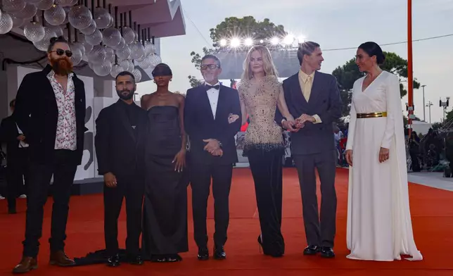 Cristobal Tapia de Veer, from left, producer David Hinojosa, Sophie Wilde, Antonio Banderas, Nicole Kidman, Harris Dickinson and director Halina Reijn pose for photographers upon arrival for the premiere of the film 'Babygirl' during the 81st edition of the Venice Film Festival in Venice, Italy, on Friday, Aug. 30, 2024. (Photo by Vianney Le Caer/Invision/AP)