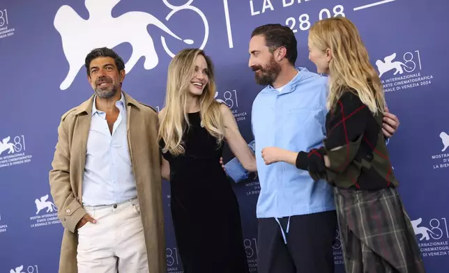 Pierfrancesco Favino, from left, Angelina Jolie, director Pablo Larrain and Alba Rohrwacher pose for photographers at the photo call for the film 'Maria' during the 81st edition of the Venice Film Festival in Venice, Italy, on Thursday, Aug. 29, 2024. (Photo by Vianney Le Caer/Invision/AP)