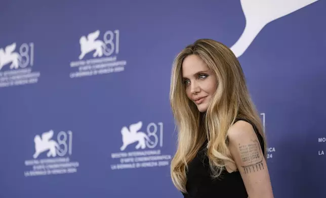 Angelina Jolie poses for photographers at the photo call for the film 'Maria' during the 81st edition of the Venice Film Festival in Venice, Italy, on Thursday, Aug. 29, 2024. (Photo by Vianney Le Caer/Invision/AP)