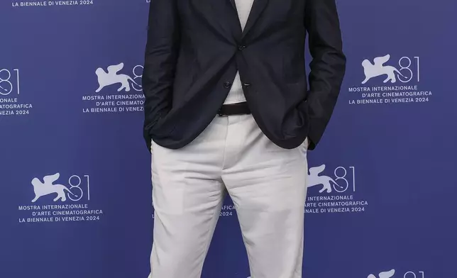 Jude Law poses for photographers at the photo call for the film 'The Order' during the 81st edition of the Venice Film Festival in Venice, Italy, on Saturday, Aug. 31, 2024. (Photo by Joel C Ryan/Invision/AP)