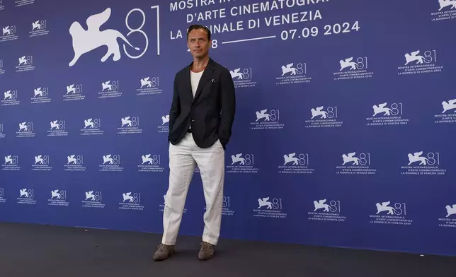 Jude Law poses for photographers at the photo call for the film 'The Order' during the 81st edition of the Venice Film Festival in Venice, Italy, on Saturday, Aug. 31, 2024. (Photo by Joel C Ryan/Invision/AP)