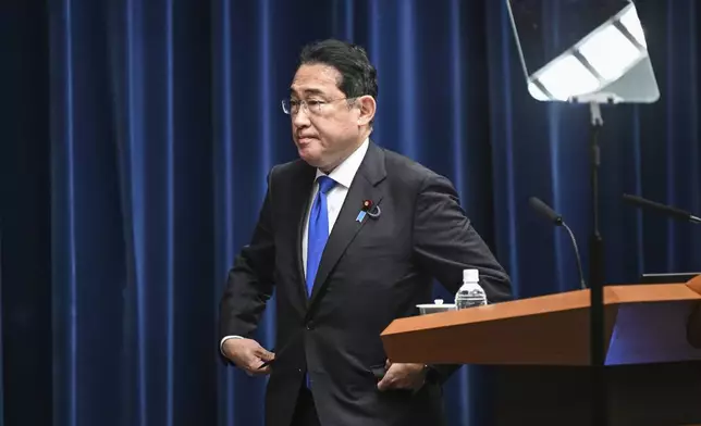 Japan's Prime Minister Fumio Kishida arrives for a press conference at his office in Tokyo Wednesday, Aug. 14, 2024. (Philip Fong/Pool Photo via AP)