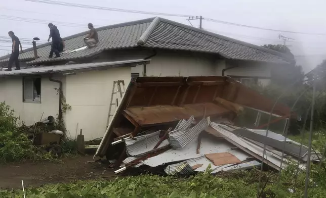 A house is seen damaged as a typhoon is approaching in Miyazaki, Miyazaki prefecture, western Japan, Wednesday, Aug. 28, 2024, as a typhoon is approaching. (Kyodo News via AP)