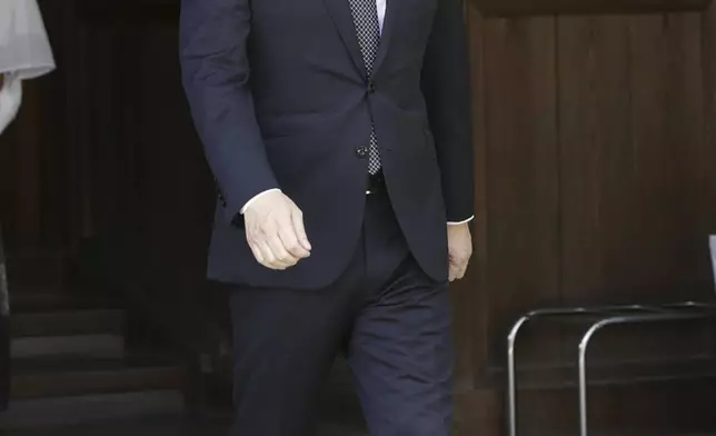 Japanese Defense Minister Minoru Kihara leaves after offering prayer for the war dead at Yasukuni Shrine, as Japan marks the 79th anniversary of its defeat in the World War II, in Tokyo, Thursday, Aug. 15, 2024. (Kyodo News via AP