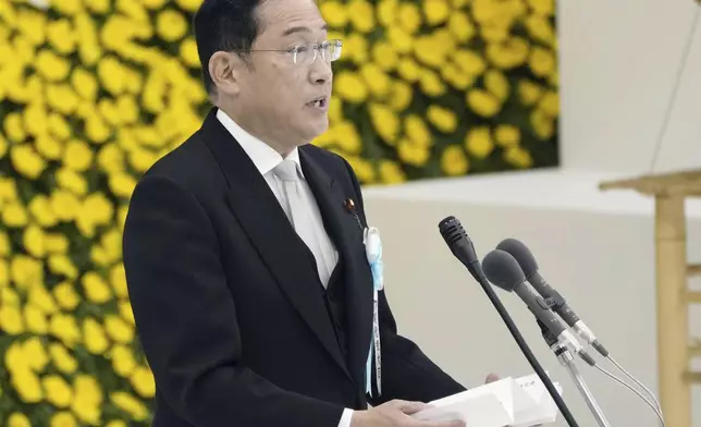 Japan's Prime Minister Fumio Kishida delivers a speech during a memorial service for the war dead at the Nippon Budokan hall in Tokyo, as the country marks the 79th anniversary of its defeat in the World War II, Thursday, Aug. 15, 2024. (Kyodo News via AP)