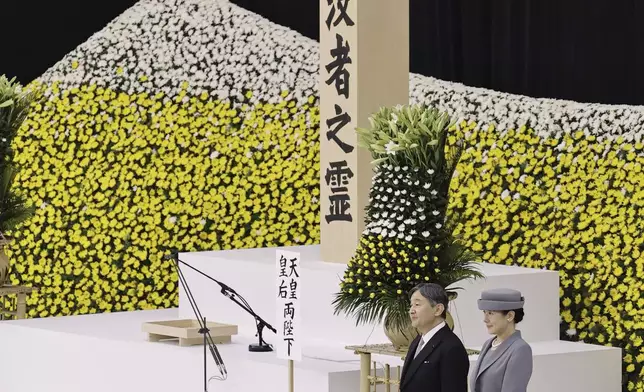 Japanese Emperor Naruhito, second right, and Empress Masako, right, attend the memorial ceremony for the war dead at the Nippon Budokan hall in Tokyo, as the country marks the 79th anniversary of its defeat in the World War II, Thursday, Aug. 15, 2024. (Kyodo News via AP)