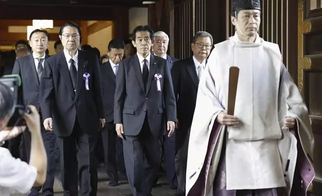 Japanese lawmakers leave after their prayer to the war dead the Yasukuni Shrine in Tokyo, as the country marks the 79th anniversary of its defeat in the World War II, Thursday, Aug. 15, 2024. (Kyodo News via AP)