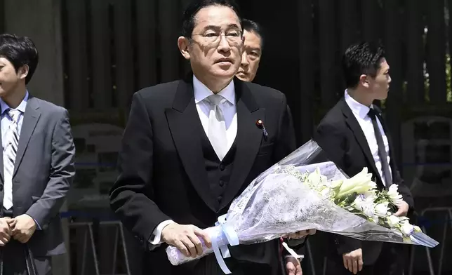 Japan’s Prime Minister Fumio Kishida visits the Chidorigafuchi National Cemetery as the country marks the 79th anniversary of its defeat in the World War II, in Tokyo, Thursday, Aug. 15, 2024. (Kyodo News via AP)