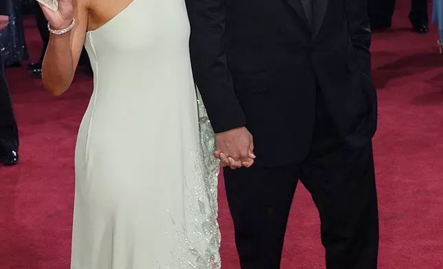 FILE - Actors Jennifer Lopez and Ben Affleck arrive for the 75th annual Academy Awards in Los Angeles on March 23, 2003. (AP Photo/Kim D. Johnson, File)