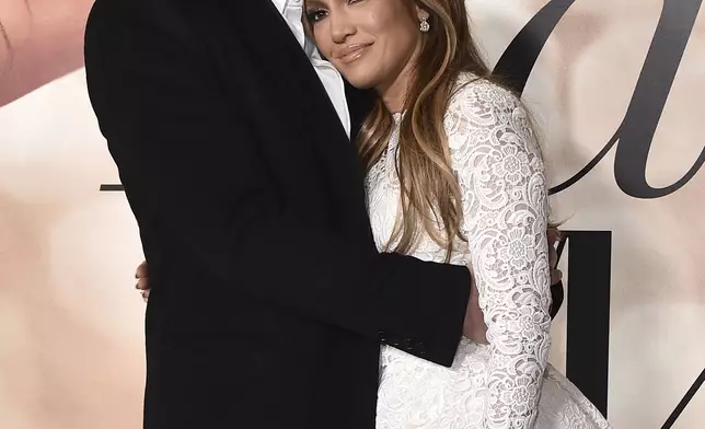 FILE - Cast member Jennifer Lopez, right, and Ben Affleck attend a photo call for a special screening of "Marry Me" on Feb. 8, 2022, in Los Angeles. (Photo by Jordan Strauss/Invision/AP, File)