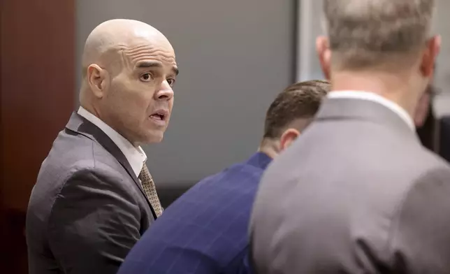 Robert Telles, left, talks with his attorneys Robert Draskovich, right, and Michael Horvath, in court prior to jury selection on the second day of his murder trial at the Regional Justice Center in Las Vegas Tuesday, Aug. 13, 2024. Telles, a former Clark County public administrator, is charged in the murder of Las Vegas Review-Journal investigative journalist Jeff German. (K.M. Cannon/Las Vegas Review-Journal via AP, Pool)