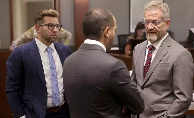 Robert Draskovich, right, and Michael Horvath, left, attorneys for Robert Telles, talk to Chief Deputy District Attorney Christopher Hamner prior to jury selection on the second day of Telles' murder trial at the Regional Justice Center in Las Vegas Tuesday, Aug. 13, 2024. Telles, a former Clark County public administrator, is charged in the murder of Las Vegas Review-Journal investigative journalist Jeff German. (K.M. Cannon/Las Vegas Review-Journal via AP, Pool)