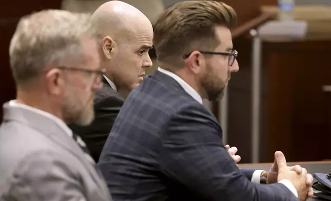 Robert Telles, center, waits in the courtroom for the verdict in his murder trial at the Regional Justice Center in Las Vegas Wednesday, August 28, 2024. Telles, a former Clark County public administrator, was found guilty in the stabbing death of Las Vegas Review-Journal investigative journalist Jeff German. With Telles are his attorneys Robert Draskovich, left, and Michael Horvath. (K.M. Cannon/Las Vegas Review-Journal via AP, Pool)