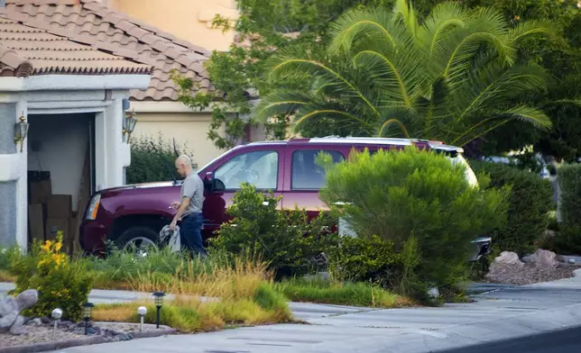 FILE - Outgoing Clark County Public Administrator Robert Telles washes his car outside his home, Sept. 6, 2022, in Las Vegas. (Benjamin Hager/Las Vegas Review-Journal via AP, File)