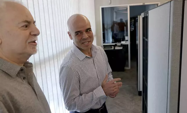 FILE - Clark County Public Administrator Robert Telles, right, talks to Las Vegas Review-Journal reporter Jeff German in his Las Vegas office, on May 11, 2022. (K.M. Cannon/Las Vegas Review-Journal via AP, File)