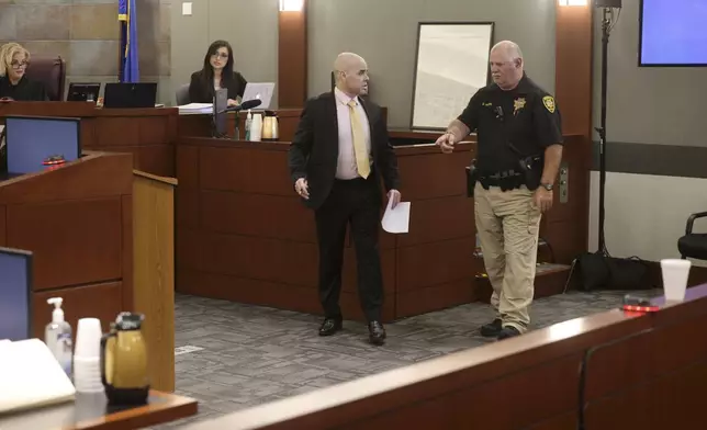 Robert Telles is directed off the witness stand after testifying during his murder trial at the Regional Justice Center in Las Vegas, Friday, Aug. 23, 2024. Telles, a former Clark County public administrator, is charged in the murder of Las Vegas Review-Journal investigative journalist Jeff German. (K.M. Cannon/Las Vegas Review-Journal via AP)