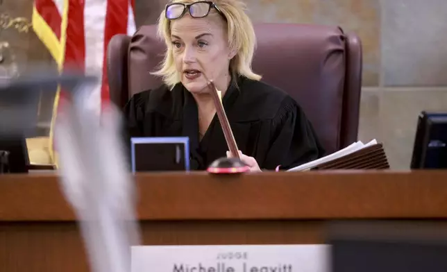 District Judge Michelle Leavitt talks to attorneys during jury selection in the murder trial of Robert Telles at the Regional Justice Center in Las Vegas, Monday, Aug. 12, 2024. Telles, a former Clark County public administrator, is accused of killing Las Vegas Review-Journal investigative journalist Jeff German. (K.M. Cannon/Las Vegas Review-Journal via AP, Pool)